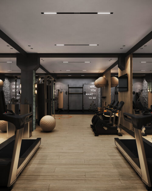 Wizualizacja wnętrza siłowni w inwestycji Bellevue Jelenia Góra ze sprzętem fitness, bieżniami i lustrami.
