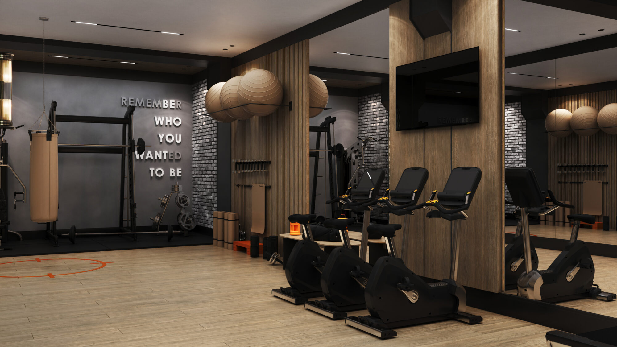 Wizualizacja wnętrza strefy fitness w inwestycji Bellevue Jelenia Góra z rowerami stacjonarnymi, stojakami na piłki i sprzętem siłowym.