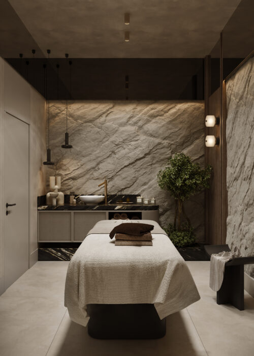 Wizualizacja wnętrza gabinetu spa i wellness w inwestycji Bellevue Jelenia Góra z łóżkiem zabiegowym i kamienną ścianą.